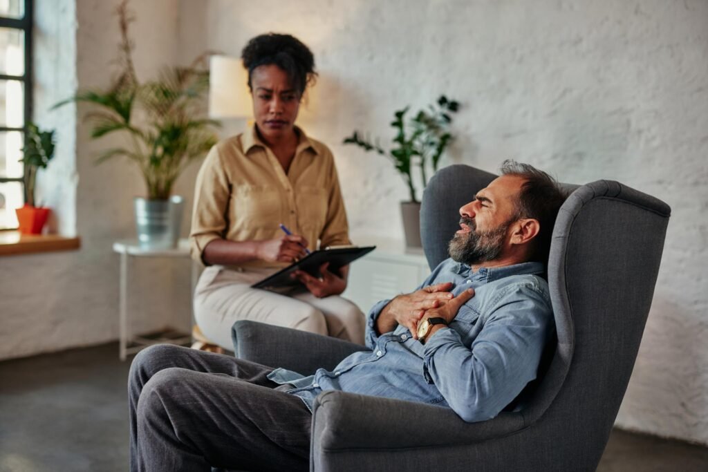 caring counselor listening to male patient c9sp74v.jpg